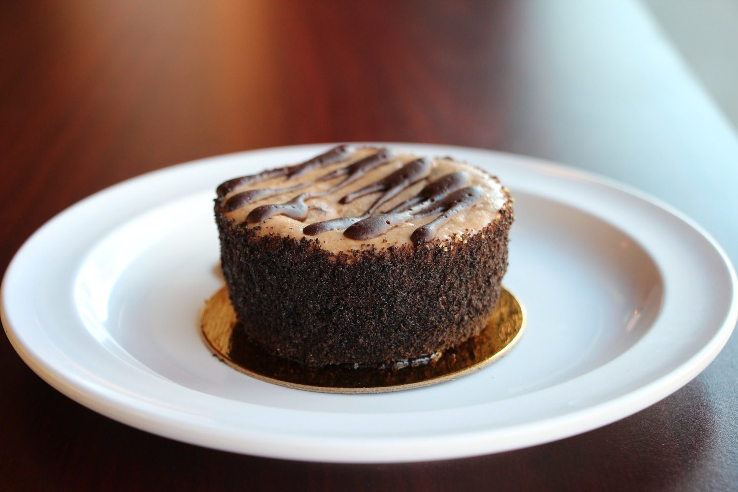 Chocolate espresso cheesecake drizzled with dark chocolate