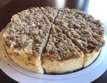 Dutch apple cheesecake under a thick streusel crumble topping