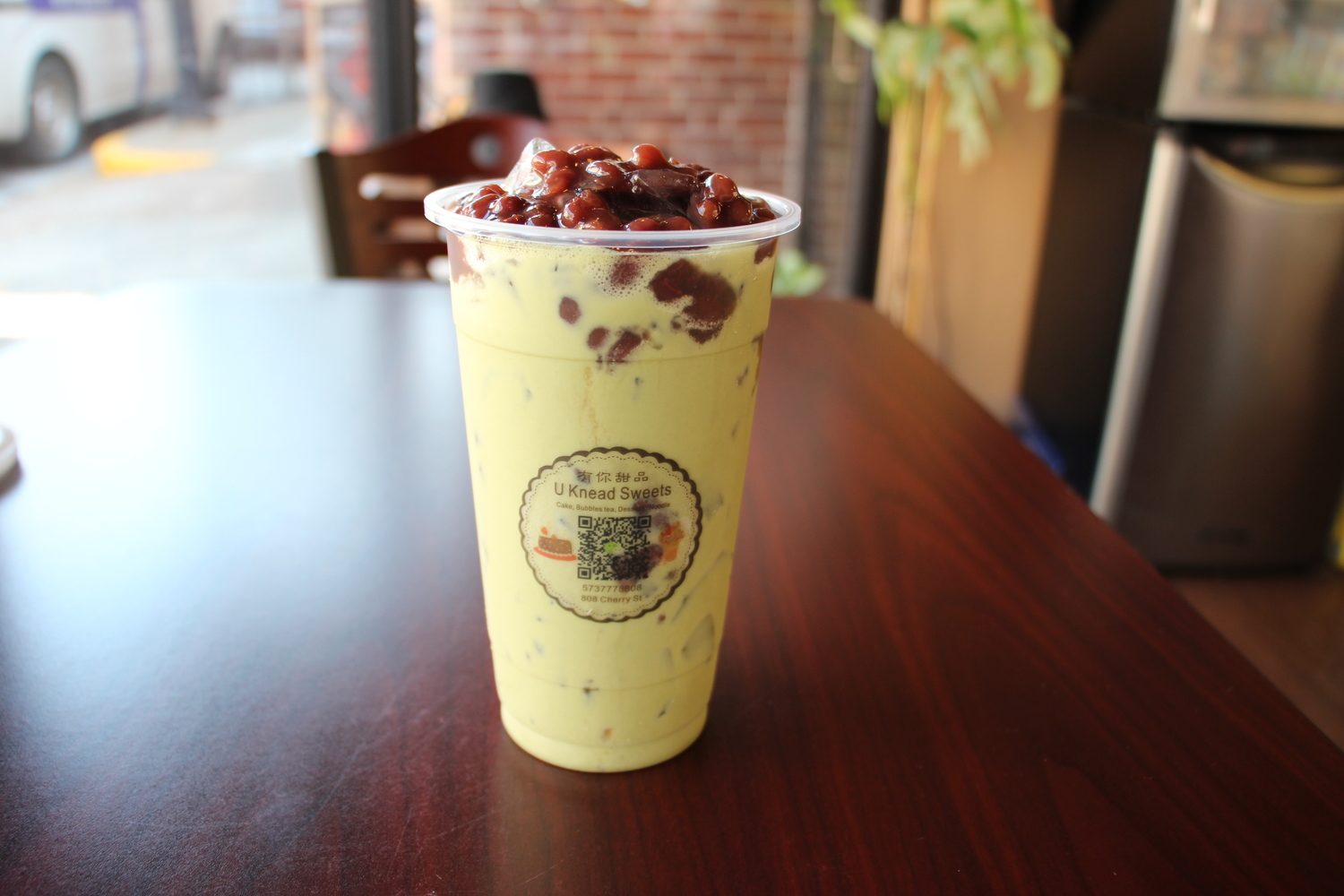 Matcha milk tea heaped with sweet red beans