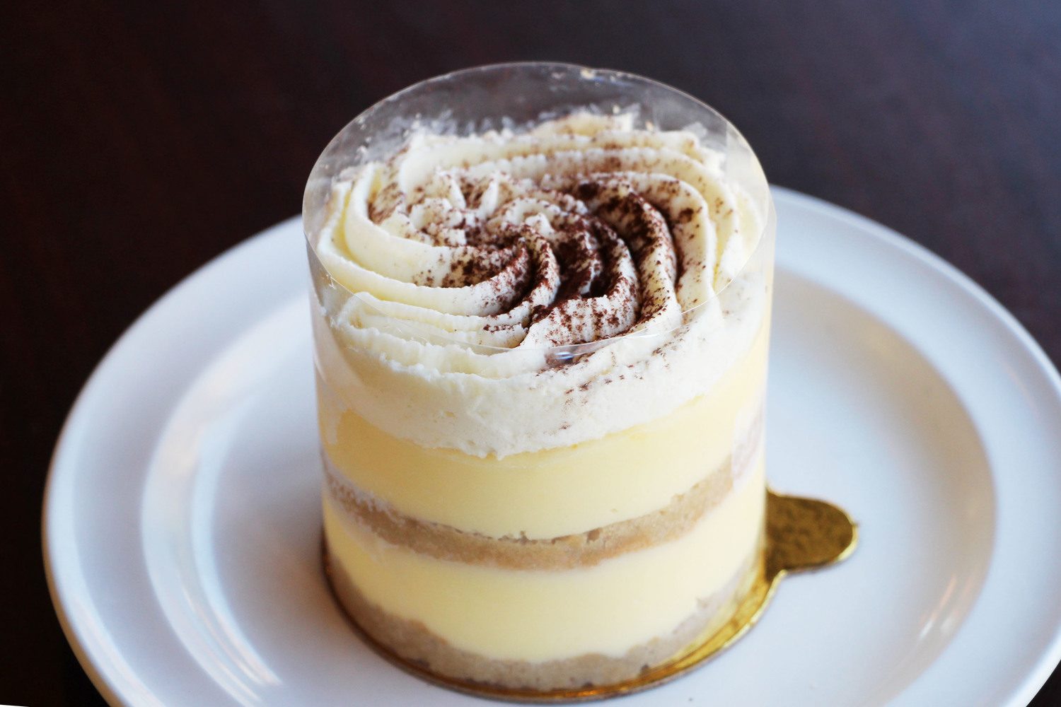 Tira-Mizzou, layered mascarpone cream and sponge dusted with cocoa
