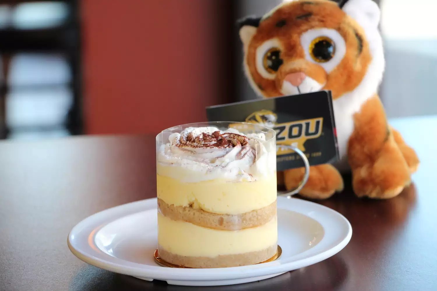 Tira-Mizzou, a layered tiramisu cup dusted with cocoa